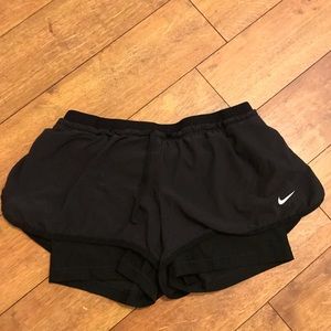 Black Nike running shorts
